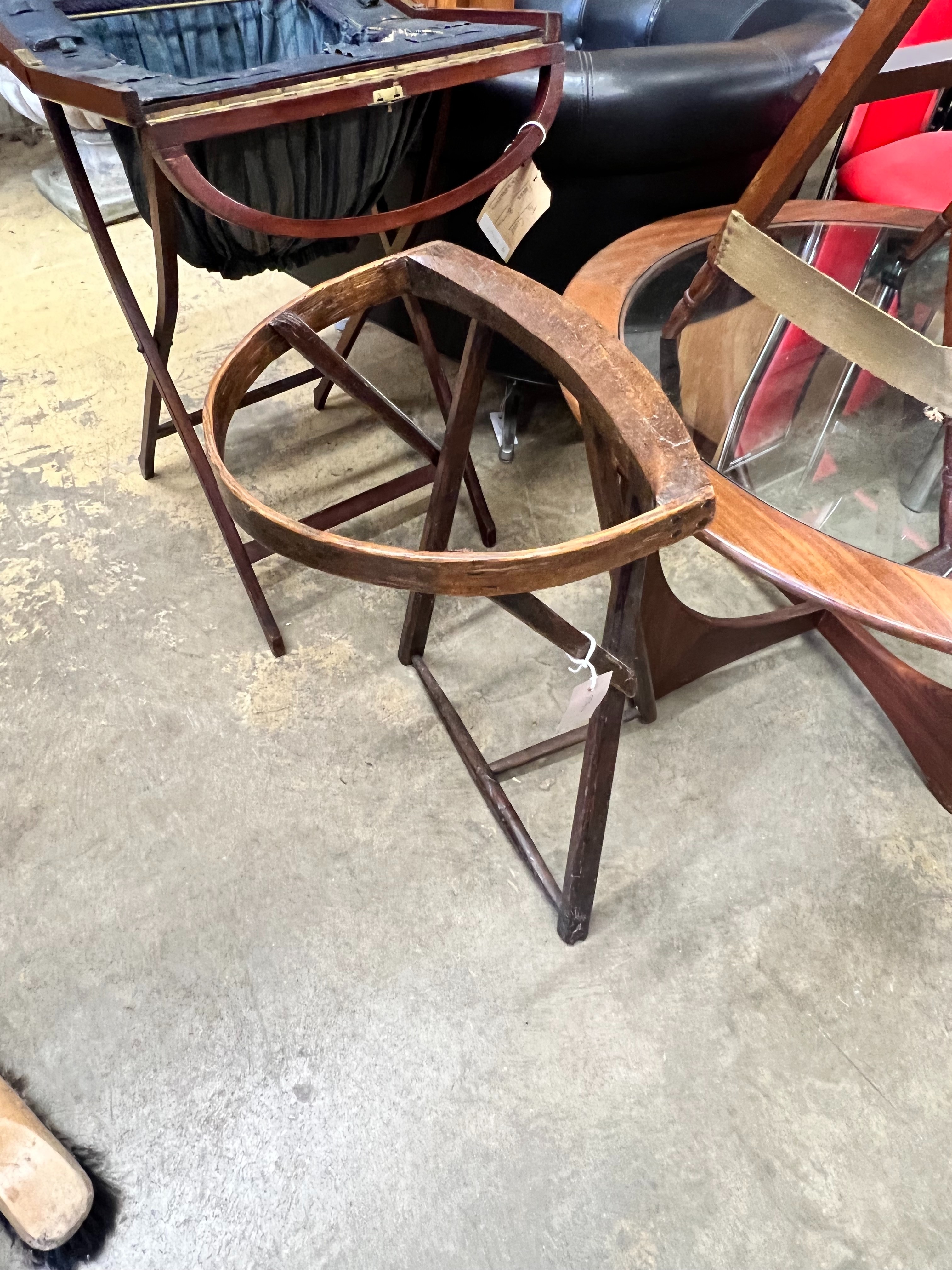 A lace pillow bolster stand, a mahogany work box on folding stand and a lacemaker's pillow stand